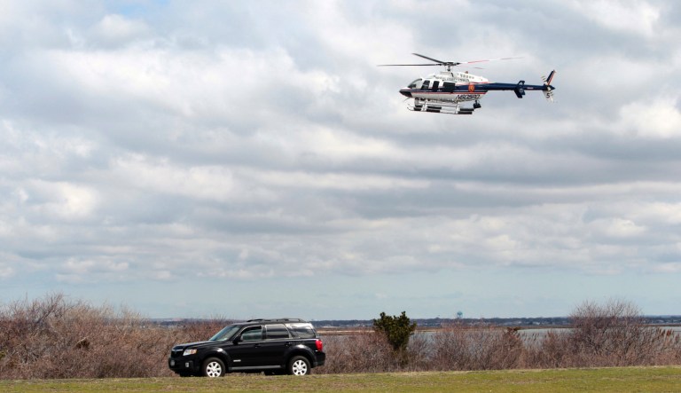 Authorities aboard a Nassau County police helicopter search for possible victims of a suspected serial killer along Ocean Parkway at Jones Beach in Wantagh, N.Y., Thursday, April 14, 2011.