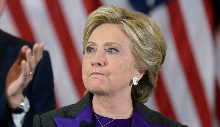 Hillary Clinton, former 2016 Democratic presidential nominee, pauses while speaking at the New Yorker Hotel in New York, U.S., on Wednesday, Nov. 9, 2016. In the hours after Donald Trump's election as the 45th president of the United States, Republicans in Congress claimed a mandate for their agenda to revamp financial rules and replace Obamacare, and Clinton urged her supporters to give him a chance to govern.