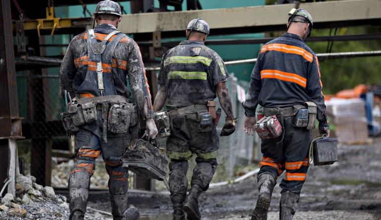 Miners carrying equipment while leaving a mine near Wylo, West Virginia, U.S.