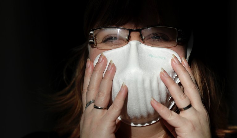 Daniela Jandova project manager of Pardam nanotechnology company demonstrates a respirator at their factory in Roudnice nad Labem, Czech Republic, Wednesday, Jan. 29, 2020.