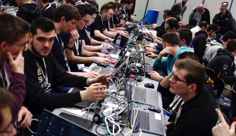 Hackers take part to a test at the Cybersecurity Conference in Lille, northern France, Tuesday Jan. 22, 2019.