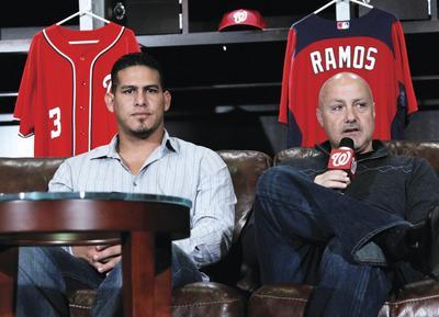 Manuel Balce Ceneta/AP
Nationals catcher Wilson Ramos, left, returned to Washington on Friday for a checkup by team doctors and a brief media session. According to general manager Mike Rizzo, Ramos was issued a clean bill of health.