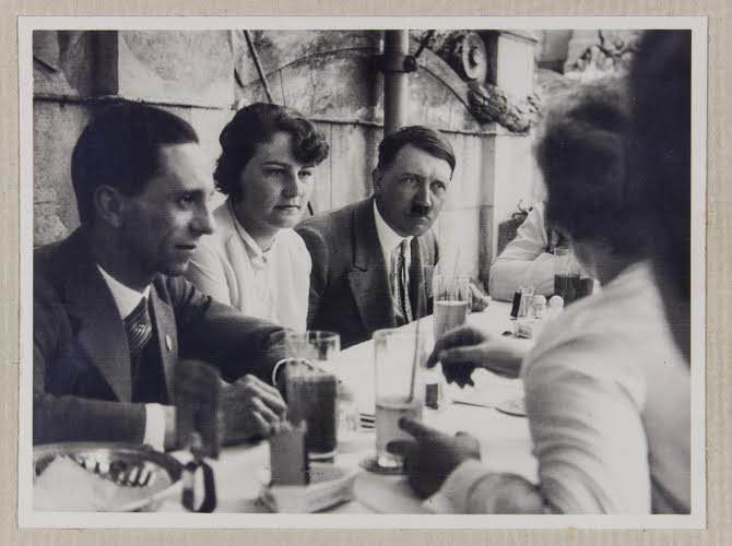 Hitler at a picnic table with his niece and alleged loverÂ Geli Raubal.