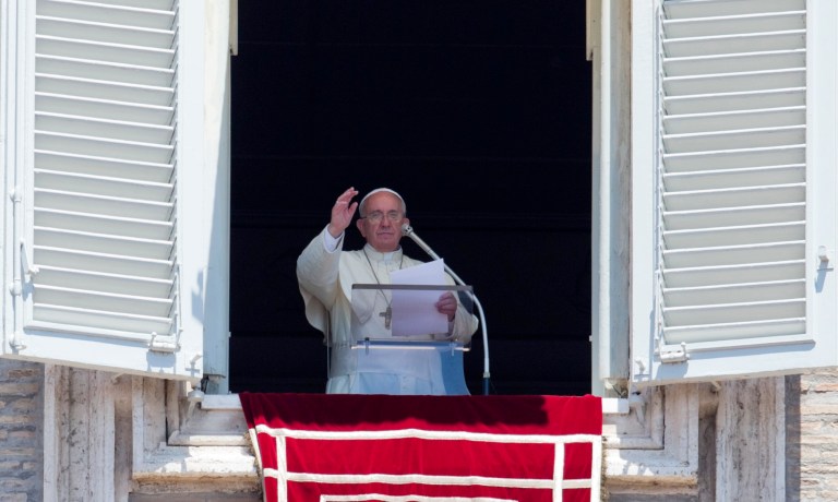 Pope Francis celebrates the Angelus noon prayer from his studio window overlooking St. Peter's square, at the Vatican, Sunday, July 6, 2014. (AP Photo/Alessandra Tarantino)