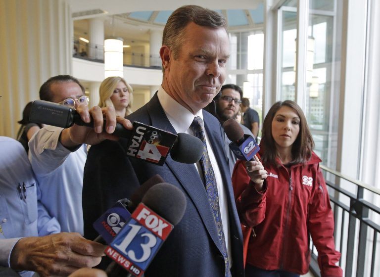 Former Utah Attorney General John Swallow arrives at court for his initial court appearance on bribery charges, Wednesday, July 30, 2014, in Salt Lake City. Swallow and former Utah Attorney General Mark Shurtleff made their first appearance as criminal defendants Wednesday, vowing to beat bribery charges and other counts. (AP Photo/Rick Bowmer)