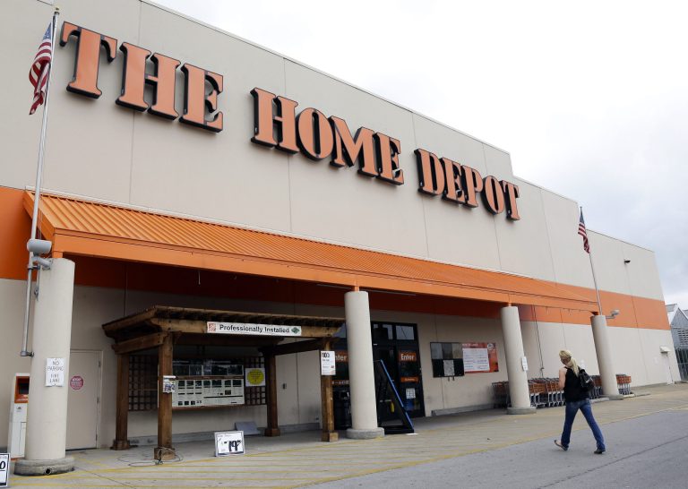 A person walks toward a Home Depot in Nashville, Tenn.