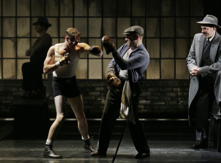   This theater image released by Lincoln Center Theater shows, from left, Seth Numrich, Danny Burstein and Danny Mastrogiorgio in 