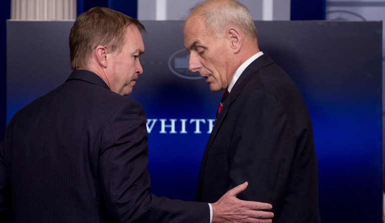 Mick Mulvaney appears in the White House briefing room with John Kelly in 2017.