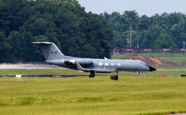 A plane taxies after arriving at Dobbins Air Reserve Base in Marietta., Ga., Saturday, Aug. 2, 2014. Officials at Emory University Hospital in Atlanta expect an American who is infected with the Ebola virus to be transported for treatment today. (AP Photo/John Bazemore)