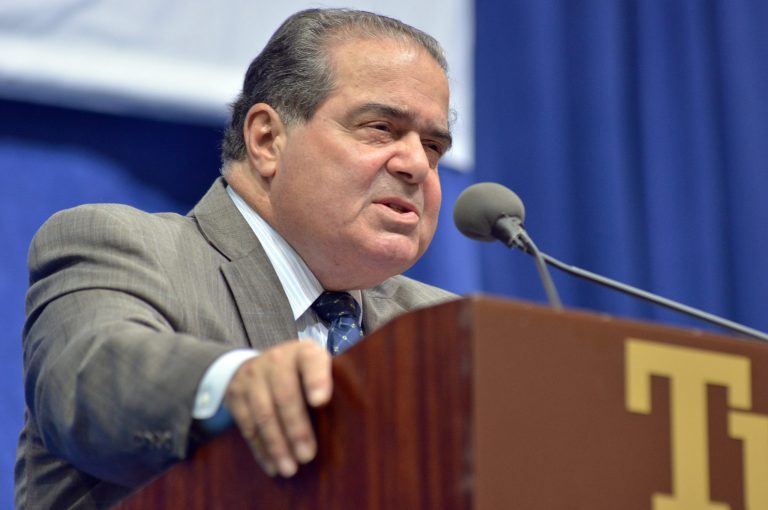 FILE - In this Oct. 2, 2013 file photo, Supreme Court Justice Antonin Scalia speaks at Tufts University in Medford, Mass. At the Supreme Court, technology can be regarded as a necessary evil, and sometimes not even necessary. When they have something to say to each other in writing, the justices never do it by e-mail. And the court's historical society says the Supreme Court had no photocopying machine until 1969, a few years after Xerox had become a verb. Among those who think the Supreme Court will weigh in is Justice Antonin Scalia, who addressed the topic in July in a question-and-answer session with a technology group. Scalia said the elected branches of government are better situated to balance security needs and privacy protections. (AP Photo/Josh Reynolds, File)