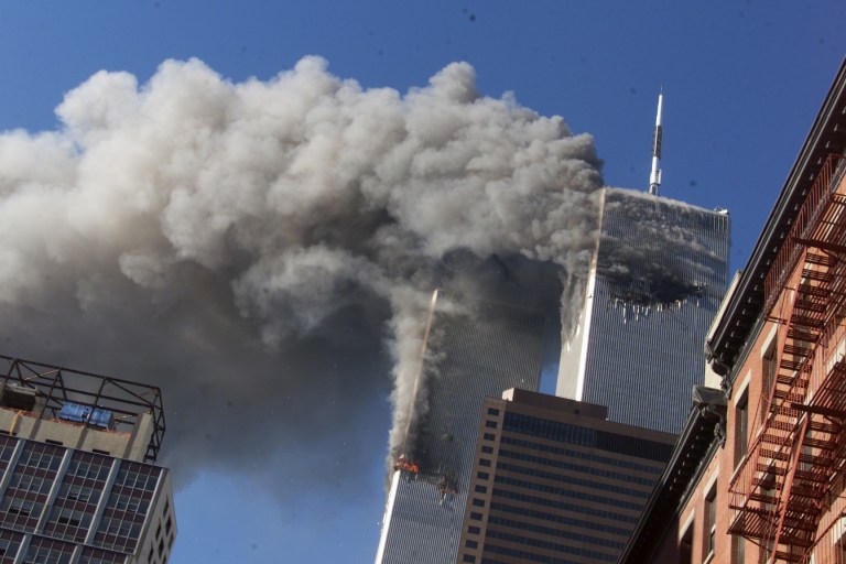   FILE - This Sept. 11, 2001 file photo shows smoke rising from the burning twin towers of the World Trade Center after hijacked planes crashed into the towers, in New York City. The U.S. government is aware of no credible or specific information that points to any terror plot tied to the anniversary of the September 2001 attacks, according to a new confidential threat assessment from the FBI and Homeland Security Department obtained by The Associated Press. (AP Photo/Richard Drew, File)  