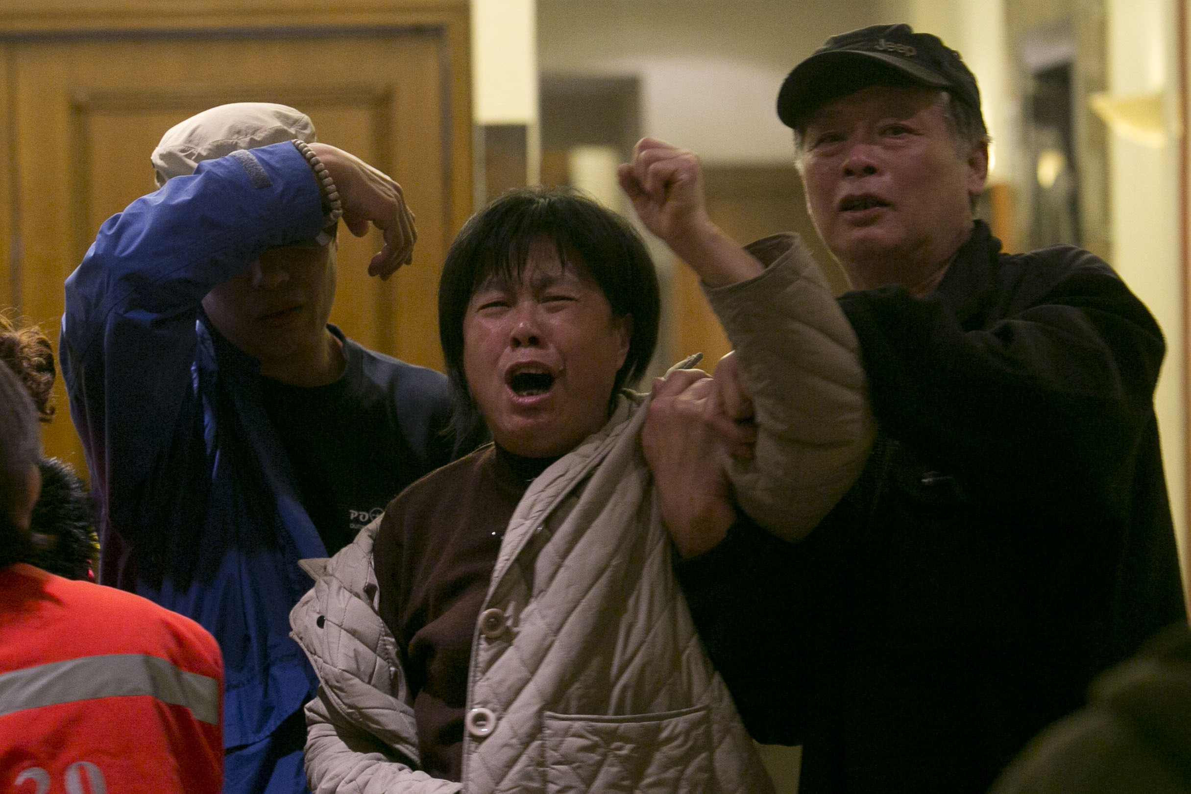 Relatives sob as Malaysia confirms plane is lost