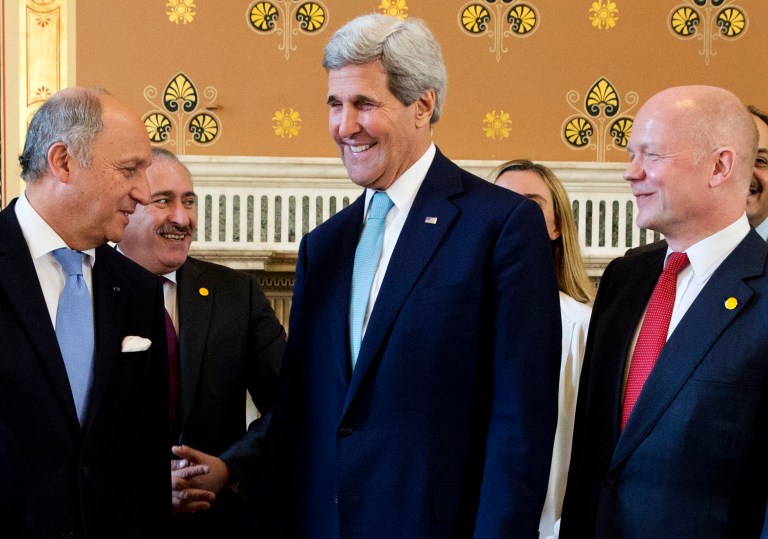 French Foreign Minister Laurent Fabius, left, talks with U.S. Secretary of State John Kerry, and British Foreign Secretary William Hague as they gather for a group photo of the London 11 at the Foreign Office in London, Thursday, May 15, 2014. (AP Photo/Jacquelyn Martin, pool)