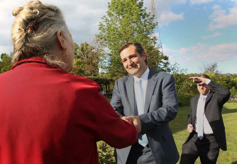 U.S. Sen Ted Cruz, R-Texas, greets his host Augusta Patrone Friday, Aug. 23, 2013 in Dublin, N.H. Cruz was the guest speaker for a fund-raiser at Patrone's Knollwood Farm for the state's Republican Party. The freshman senator has made national headlines suggesting that Republicans in Congress shut down the federal government to stop implementation of President Barack Obama's signature health care overhaul, the Affordable Care Act.(AP Photo/Jim Cole)