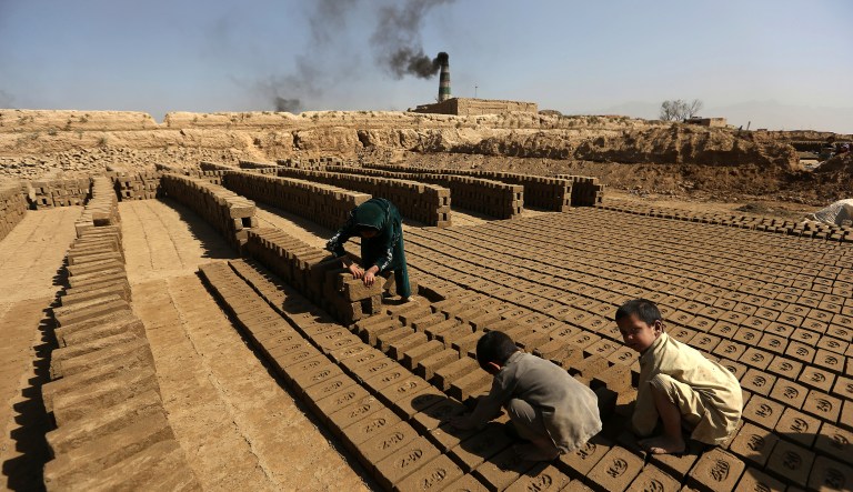 We need to get rid of, say, child labor, rather than agonizing over who buys what from whom. (AP Photo/Rahmat Gul, File)