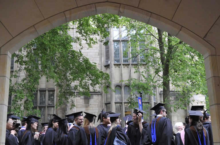 ADVANCE FOR SUNDAY MARCH 3 - FILE - In this Monday, May 24, 2010 file photo, future graduates wait for the procession to begin for commencement at Yale University in New Haven, Conn. U.S. universities have responded to exploding demand in China for American higher education with branch campuses and aggressive recruiting. Now, some are trying to boost their brands by casting campus photos into the confounding sea of Chinese social media. (AP Photo/Jessica Hill)