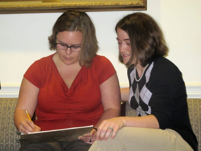 Sara Meadows, left, and Jennifer Rose, both of Charleston, S.C., fill out an application for a marriage license at the Probate Court office in Charleston, S.C., on Thursday. (AP/Bruce Smith)