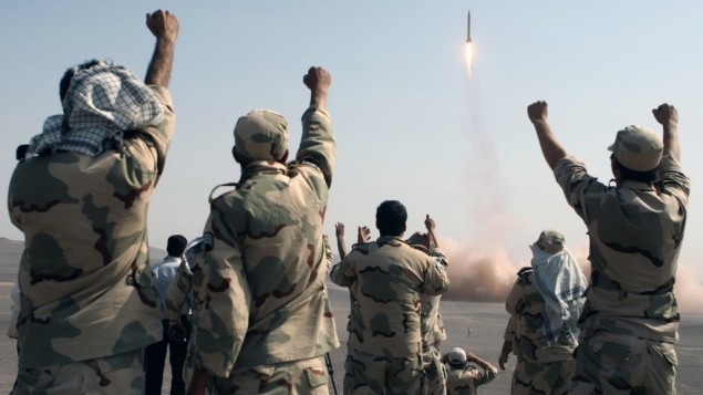 Members of the Iranian Revolutionary Guard celebrate after launching a missile in July 2012. (AP/IRNA, Mostafa Qotbi)