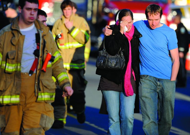 Victims family leave a firehouse staging area following a shooting at the Sandy Hook School in Newtown, Conn. where authorities say a gunman opened fire, leaving 27 people dead, including 20 children, Friday, Dec. 14, 2012. (AP Photo/Jessica Hill)