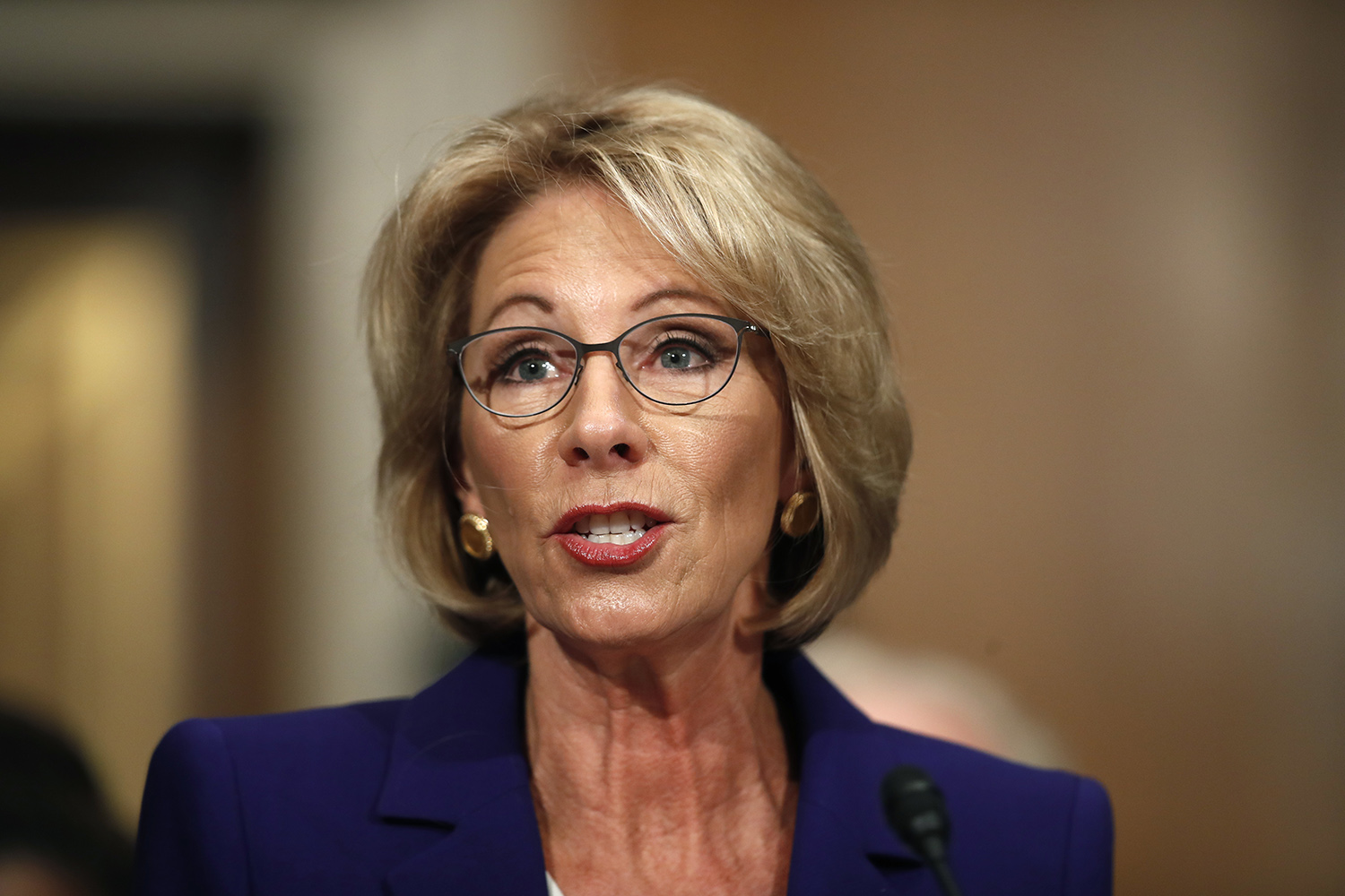 DeVos nomination approved in party-line committee vote