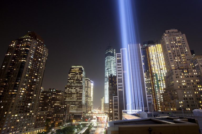   The Tribute in Light rises above lower Manhattan, during a test, Tuesday, Sept. 10, 2013 in New York. The light display commemorates the twin towers of the World Trade Center that were destroyed in terrorist attacks 12 years ago on Sept. 11, 2001. One World Trade Center is in the center background. (AP Photo/Mark Lennihan)  