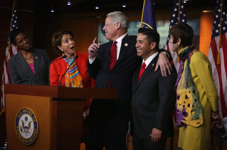 U.S. House Minority Leader Rep. Nancy Pelosi (D-CA) (2nd L), Rep. Ben Ray Lujan (D-NM) (4th L), Rep. Steve Israel (D-NY) (3rd L), Rep. Rosa DeLauro (D-CT) (R), and Rep. Donna Edwards (D-MD) (L) share a moment during a news conference to announce new members of the House Democratic leadership team Nov. 17, 2014 on Capitol Hill in Washington, DC. (Photo by Alex Wong/Getty images)