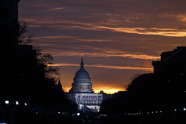 The Capitol Building is illuminated against the sunrise before the presidential inauguration of President-elect Donald Trump, Friday, Jan. 20, 2017, in Washington. (AP Photo/John Minchillo)