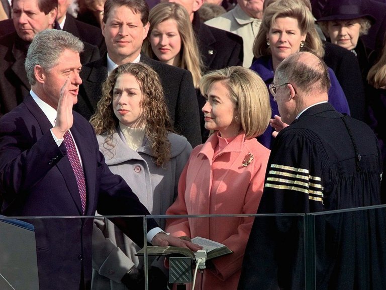 Supreme Court Chief Justice William Rehnquist administers the presidential oath to President Clinton as first lady Hillary Rodham Clinton and daughter Chelsea look on, Monday Jan. 20, 1997. Team Clinton is reading for when Bill Clinton holds the Bible for Hillary Clinton's swearing in. (AP Photo/Doug Mills)
