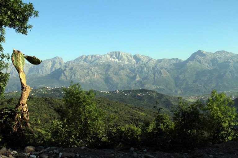 FILE - In this May 8, 2012 file photo shows the snow capped peaks of the Djura Djura mountains in the rugged Berber-speaking Kabylie region of Algeria , 75 miles (120 kilometers) east of Algiers.  A splinter group from al-Qaida's North African branch kidnapped a French citizen and said Monday Sept.22, 2014 that it would kill him unless France halts it airstrikes against the Islamic State group in Iraq. In a video that appeared on social media, a masked member of a group calling itself Jund al-Khilafah, or Soldiers of the Caliphate, addressed the threat to French President Francois Hollande and said the hostage would be killed unless the airstrikes were halted within 24 hours. (AP Photo/Paul Schemm, File)