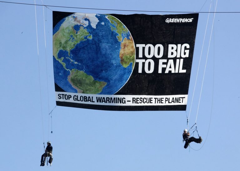 Greenpeace protesters, not strangers to publicity stunts, hang with a banner from a construction crane on 23rd street near the State Department on April 27, 2009 in Washington, D.C. (Photo by Mark Wilson/Getty Images)