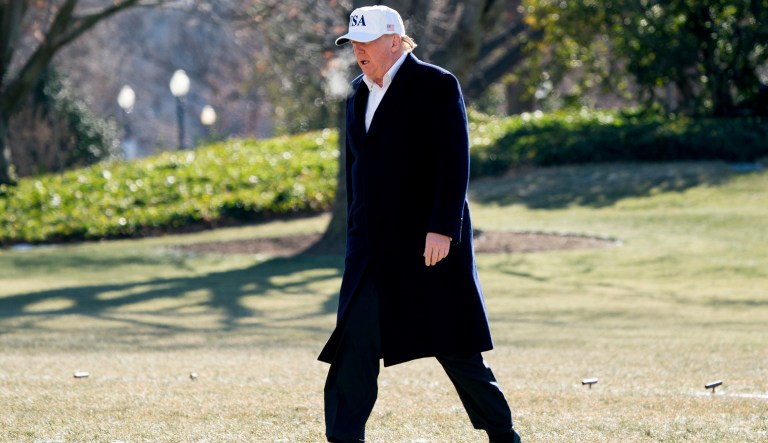 President Donald Trump walks across the South Lawn as he arrives at the White House in Washington, Sunday, Jan. 7, 2018, after traveling from Camp David, Md. (AP Photo/Andrew Harnik)