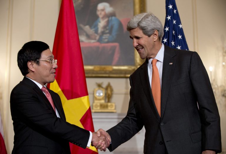 Secretary of State John Kerry shakes hands with Vietnamese Foreign Minister Pham Binh Minh as they speak to media at the State Department in Washington, Thursday, Oct. 2, 2014, before having a working lunch. (AP Photo/Carolyn Kaster)