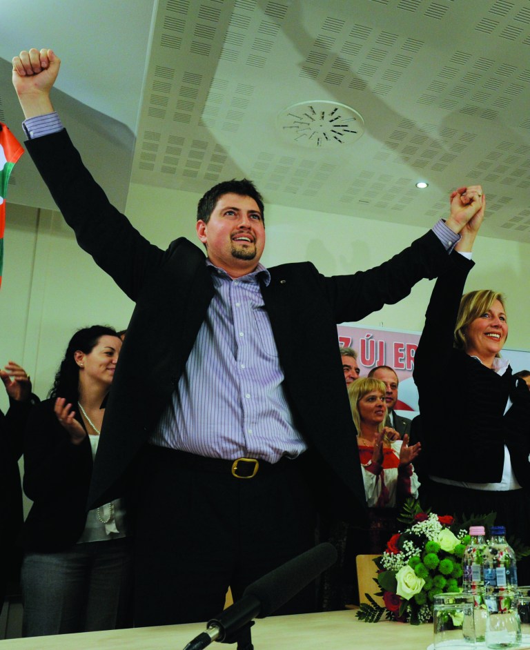 FILE - This file photo dated on June 7, 2009 shows Hungary's far right party, Jobbik's, Csanad Szegedi, left, and Krisztina Morvai, right, celebrating their entry into the European Parliament after the European parliamentary election in Budapest, Hungary. Szegedi, who was notorious for his incendiary comments on Jews, acknowledged in June that his grandparents on his mother's side were Jews. After resigning last month from all his party positions he was also asked by Jobbik to give up his seat in the European Parliament as well. (AP Photo/Bela Szandelszky, File)