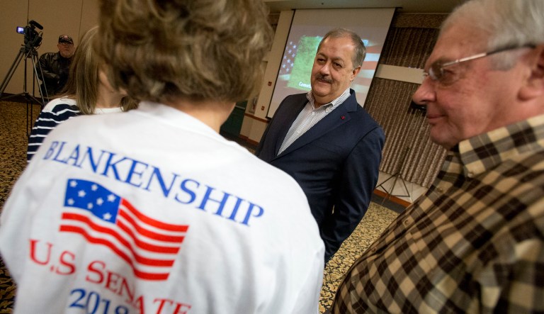 Supporters talk with former Massey CEO and West Virginia Republican Senatorial candidate, Don Blankenship, center, prior to a town hall to kick off his campaign in Logan, W.Va., Thursday, Jan. 18, 2018. Blankenship will face two other Republican candidates in the May 8th primary.