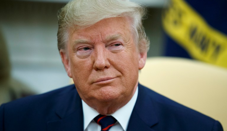 President Donald Trump listens during a meeting with Italian President Sergio Mattarella in the Oval Office of the White House, Tuesday, Oct. 15, 2019, in Washington.