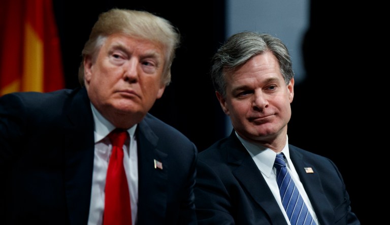 President Donald Trump sits with FBI Director Christopher Wray during the FBI National Academy graduation ceremony, Friday, Dec. 15, 2017, in Quantico, Va.