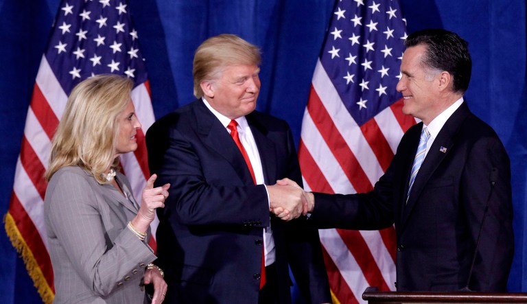 FILE - In this Thursday, Feb. 2, 2012 file photo, Donald Trump greets Republican presidential candidate, former Massachusetts Gov. Mitt Romney, after announcing his endorsement of Romney during a news conference in Las Vegas. Trump is endorsing Romney in Utah's Senate race, another sign that the two Republicans are burying the hatchet after a fraught relationship.
