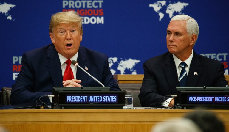 Vice President Mike Pence listens as President Donald Trump speaks at an event on religious freedom during the United Nations General Assembly, Monday, Sept. 23, 2019, in New York.