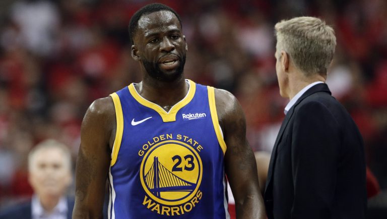 Golden State Warrior Draymond Green (23) walks to the sideline past head coach Steve Kerr, right, during the first half of Game 6 of a second-round NBA basketball playoff series, Friday, May 10, 2019, in Houston.
