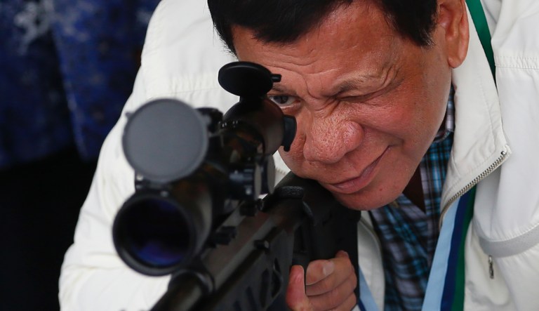 Philippine President Rodrigo Duterte checks the scope of a Chinese-made CS/LR4A Sniper's Rifle during the ceremonial turnover of thousands of brand-new rifles and more than six million ammunitions by China to the Philippines Wednesday, June 28, 2017 at Clark Airbase in northern Philippines. In the Palace statement, the firearms form "part of the military aid package by China in relation with the emerging threat of terrorism and piracy in southern Philippines.                                                         