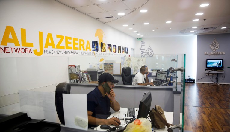 Israel's communications minister has sought to ban Al Jazeera from broadcasting in Israel, accusing the network of inciting violence. (AP Photo/Mahmoud Illean)