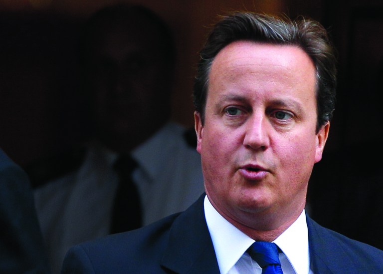 FILE This Wednesday, Sept. 14, 2011 file photo shows Britain's Prime Minister David Cameron leaving Downing Street in London, to attend the weekly Prime Ministers Questions in Parliament. Goodbye Britain? For the European Union, a once-unthinkable question is looking more like a real possibility with each new grinding week of economic crisis. The reason is that bad times are forcing the 17 EU nations that use the euro currency to move ever closer toward some kind of United States of Europe _ one that could make decisions about how much member countries spend and how much tax they collect. If ever Britain had a nightmare, that's it. (AP Photo/Kirsty Wigglesworth)