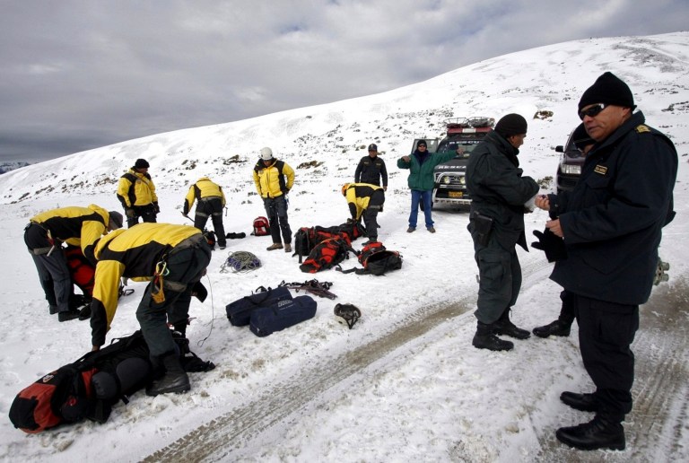   In this photo provide by Andina Agency, police gather to continue searching for a missing helicopter in the department of Cuzco, Peru, Friday, June 8, 2012. Poor weather continues to impede the search for a helicopter that went missing on Wednesday in Peru's highlands with eight South Koreans and three Europeans aboard. (AP Photo/Percy Hurtado, Andina Agency)  
