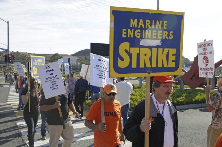 Golden Gate Ferry workers picket outside the ferry terminal during a one-day strike Friday, Sept. 26, 2014, in Larkspur, Calif. Golden Gate Ferry workers have gone on strike, shutting down commuter service between Marin County and San Francisco. Flyers were left on the seats of ferry boats letting people know that the Larkspur, Sausalito and San Francisco terminals will not be operating Friday from 4:30 a.m. until 9 p.m.  (AP Photo/Eric Risberg)