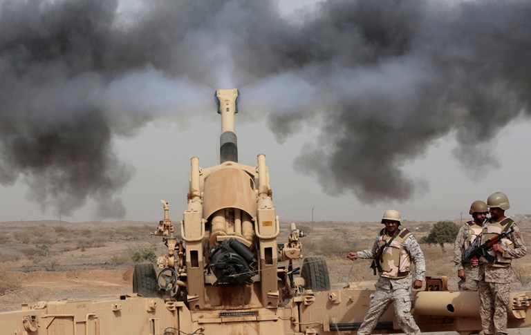 In this April 20, 2015 file photo, Saudi soldiers fire artillery toward three armed vehicles approaching the Saudi border with Yemen in Jazan, Saudi Arabia. (AP Photo/Hasan Jamali, File)