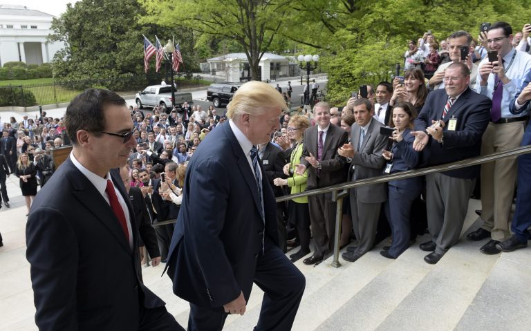 President Donald Trump and Treasury Secretary Steven Mnuchin arrive at the Treasury Department in Washington, Friday, April 21, 2017, where the president signed an executive order to review tax regulations set last year by his predecessor, as well as two memos to potentially reconsider major elements of the 2010 Dodd-Frank financial reforms passed in the wake of the Great Recession. (AP Photo/Susan Walsh)