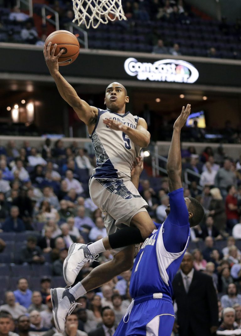 Alex Brandon/AP
Georgetown guard Markel Starks goes up for a shot in front of Seton Hall guard Aaron Cosby as the Hoyas defeated the Pirates 74-52 at the Verizon Center on Wednesday.