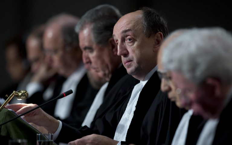   Presiding judge Tomka, third from right, opens the hearings in a dispute between Peru and Chile over the two countries' maritime boundary at the International Court of Justice in The Hague, Monday Dec. 3, 2012. (AP Photo/Peter Dejong)  