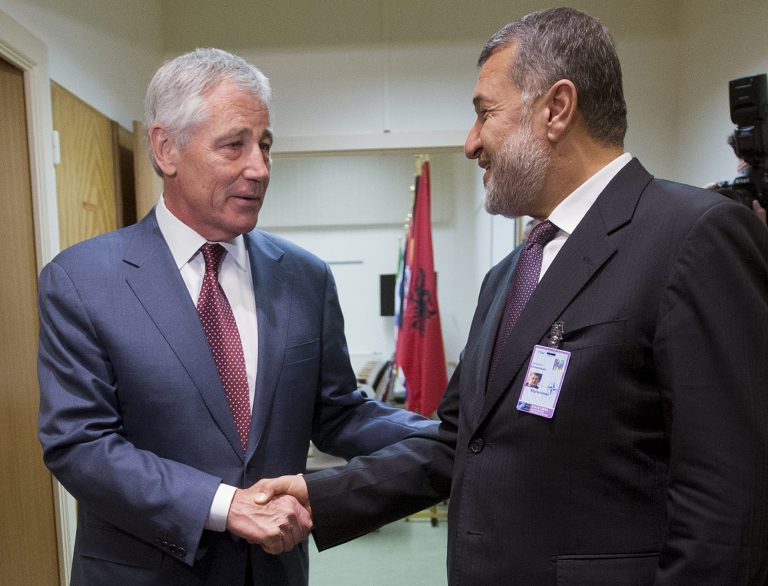 U.S. Defense Secretary Chuck Hagel, left, shakes hands with Afghanistan's Defense Minister Bismillah Khan Mohammadi, right, ahead of their North Atlantic Council (NAT) meeting, in Brussels, Wednesday, June 4, 2014. (AP Photo/Pablo Martinez Monsivais, Pool)