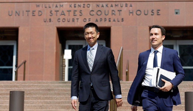 Hawaii Attorney General Doug Chin, left, has been vocal about his disappointment in President Trump's policy decisions since the beginning. (AP Photo/Elaine Thompson)